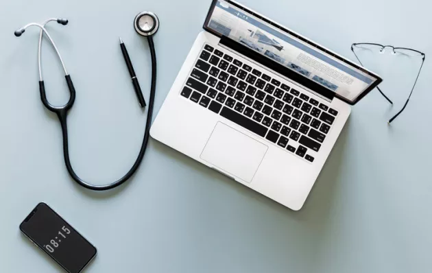 Picture of a laptop and stethoscope