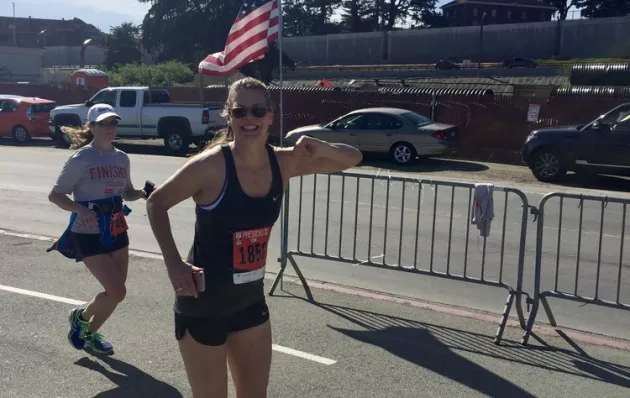 Photo of Molly crossing the finish line